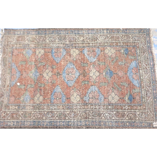 2096 - Late 19th century hand knotted floor rug with designs against an orange ground, 120 x 76 cm. Not ava... 