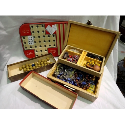 1135 - Collection of marbles and a tin plate solitaire board. Not available for in-house P&P