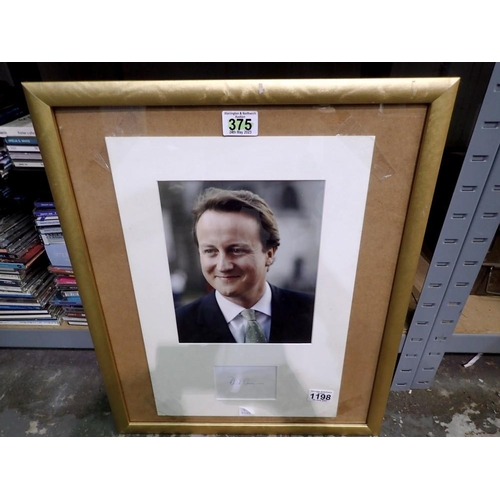 1198 - Framed David Cameron press photograph and signature. Not available for in-house P&P