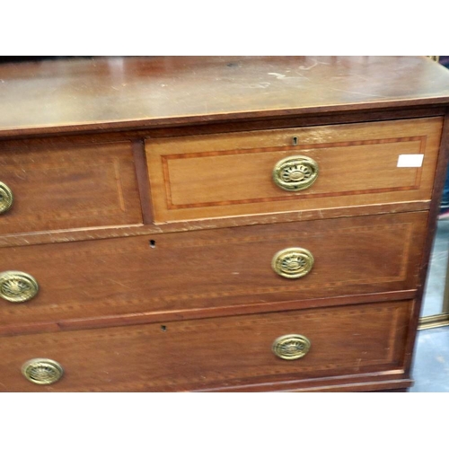 2102 - An Edwardian walnut chest of two short above two long drawers, inlaid with satinwood and ebony strin... 