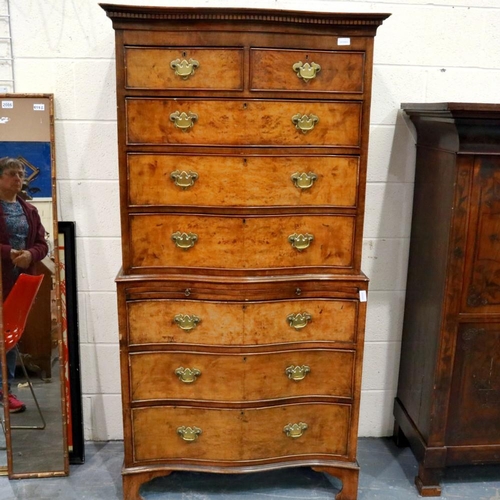 2103 - Burr walnut serpentine fronted chest on chest, comprising two short over seven long drawers. Not ava... 