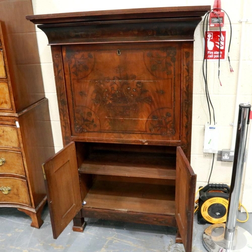 2104 - An early 19th century continental walnut scriptoire, with drop front and fitted interior, profusely ... 