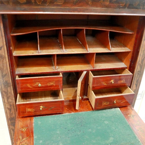 2104 - An early 19th century continental walnut scriptoire, with drop front and fitted interior, profusely ... 