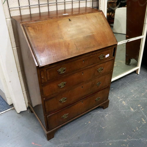 2105 - A 19th century walnut fall front bureau of small proportions, crossbanded and with fitted interior, ... 