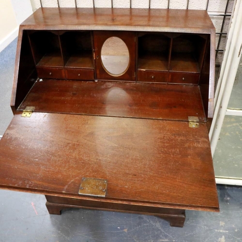 2105 - A 19th century walnut fall front bureau of small proportions, crossbanded and with fitted interior, ... 