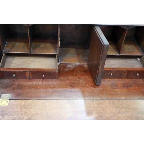 2105 - A 19th century walnut fall front bureau of small proportions, crossbanded and with fitted interior, ... 