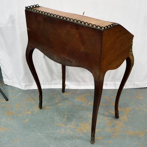 2111 - A French writing bureau of simple bombe from inlaid with flora and strung with ormolu mounts and gal... 