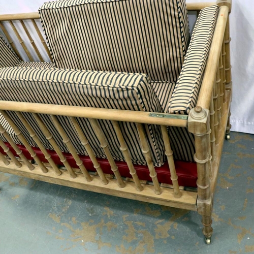 2115 - An Edwardian pine framed cot with one drop side and internal cushion, 127 x 63 x 81 cm H. Not availa... 