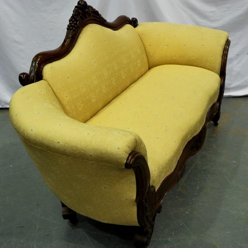 2139 - Carved walnut framed upholstered open settee on brass castors, L: 180 cm. Not available for in-house... 