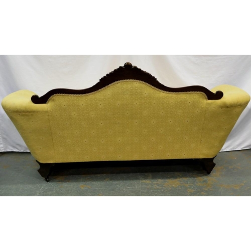 2139 - Carved walnut framed upholstered open settee on brass castors, L: 180 cm. Not available for in-house... 