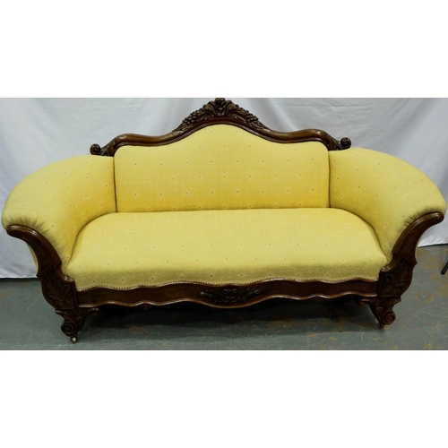 2139 - Carved walnut framed upholstered open settee on brass castors, L: 180 cm. Not available for in-house... 