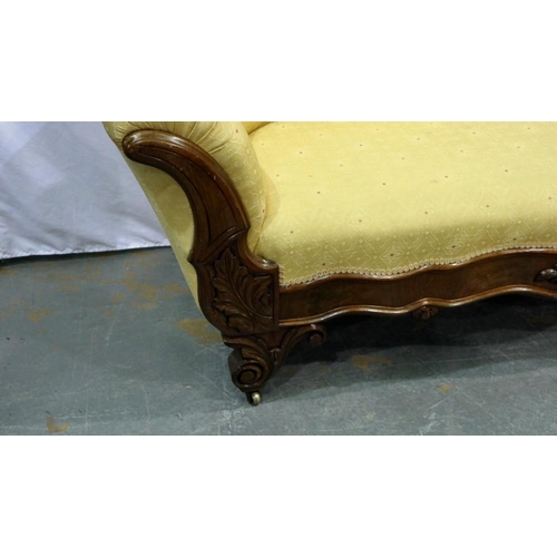 2139 - Carved walnut framed upholstered open settee on brass castors, L: 180 cm. Not available for in-house... 