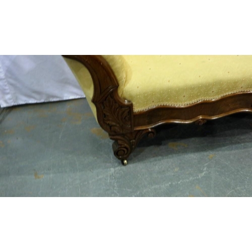 2139 - Carved walnut framed upholstered open settee on brass castors, L: 180 cm. Not available for in-house... 