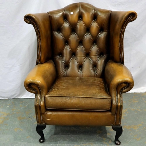 2140 - Brown leather button back winged armchair with extra seat cushion. Not available for in-house P&P