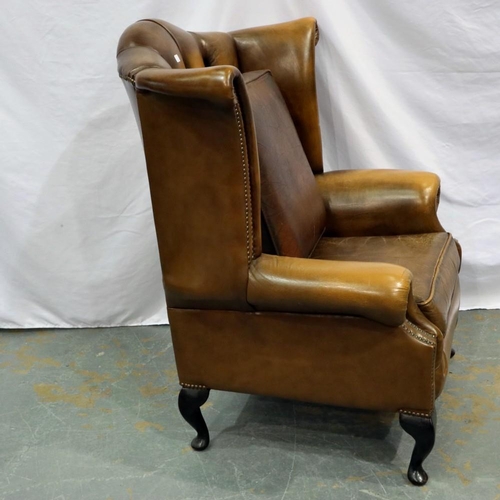 2140 - Brown leather button back winged armchair with extra seat cushion. Not available for in-house P&P