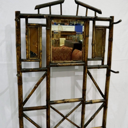 2144 - Bamboo hall stand with central mirror, all six pegs and drip trays present, 72 x 28 x 188 cm H. Not ... 