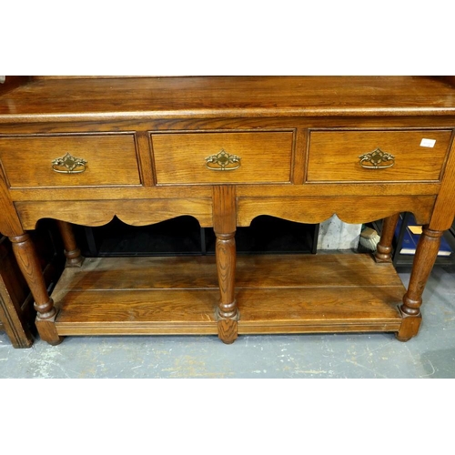 2147 - Oak dresser with shelf base, three drawers and plate rack, 145 x 42 x 190 cm H. Not available for in... 