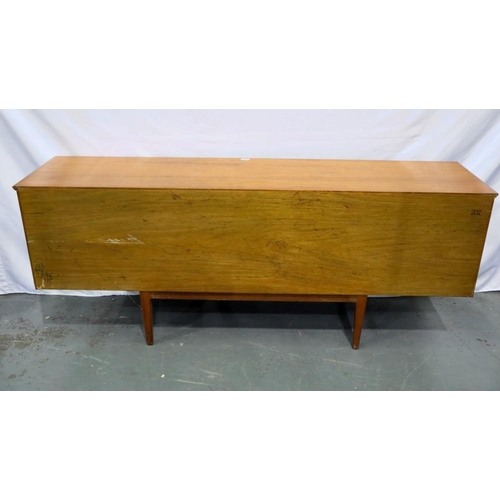 2161 - Long teak sideboard with central cupboard door, drop down asymmetric cupboard and three drawers, 183... 