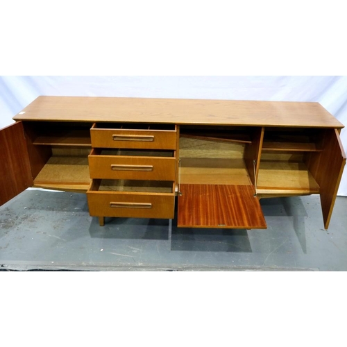 2162 - Long teak asymmetric sideboard with two end cupboards, drop down cupboard and four drawers, 183 x 45... 