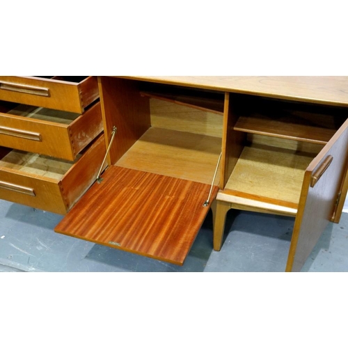 2162 - Long teak asymmetric sideboard with two end cupboards, drop down cupboard and four drawers, 183 x 45... 