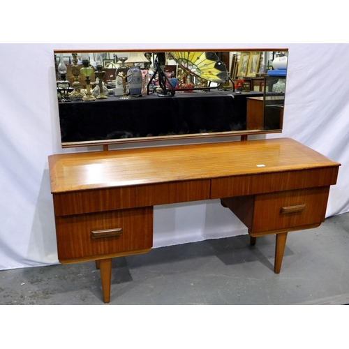 2164 - 1970s teak dressing table with two long over two shelf drawers on tapering supports, 140 x 45 cm. No... 