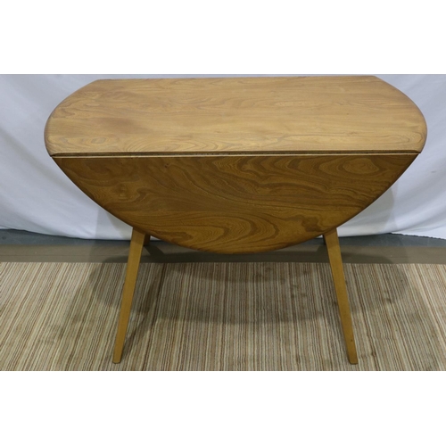 2171 - Ercol elm drop leaf circular table on supports, D: 120 cm. Not available for in-house P&P