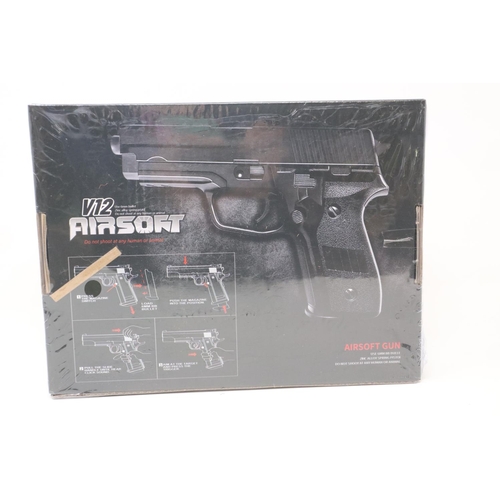 2113 - New old stock airsoft pistol, model V12 in brown, boxed and factory sealed. P&P Group 2 (£18+VAT for... 