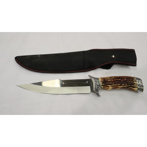 2134 - A modern hunting knife with faux antler grip and canvas sheath. P&P Group 2 (£18+VAT for the first l... 