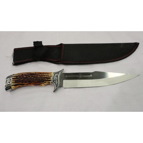 2134 - A modern hunting knife with faux antler grip and canvas sheath. P&P Group 2 (£18+VAT for the first l... 