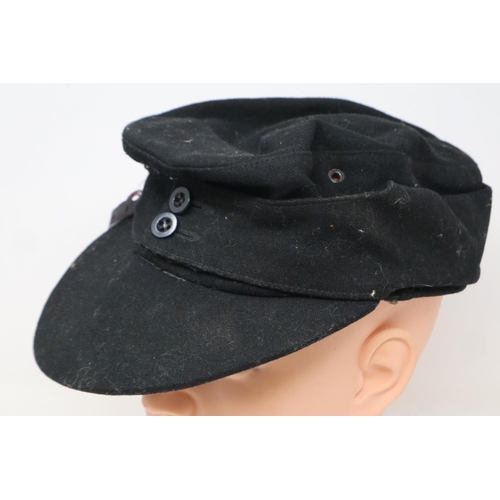 2186 - WWII German M43 Panzer side cap, black wool construction with removed insignia, (possibly POW). The ... 