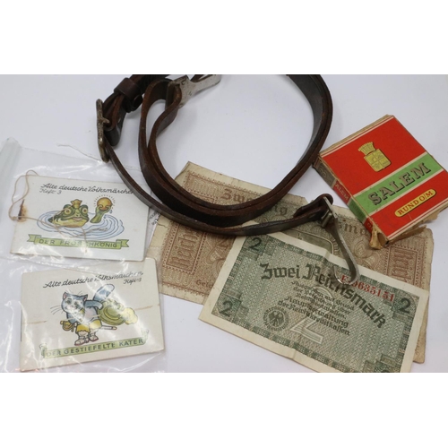 2229 - WWII German items from the Occupied British Channel Islands, comprising occupation money, German cig... 