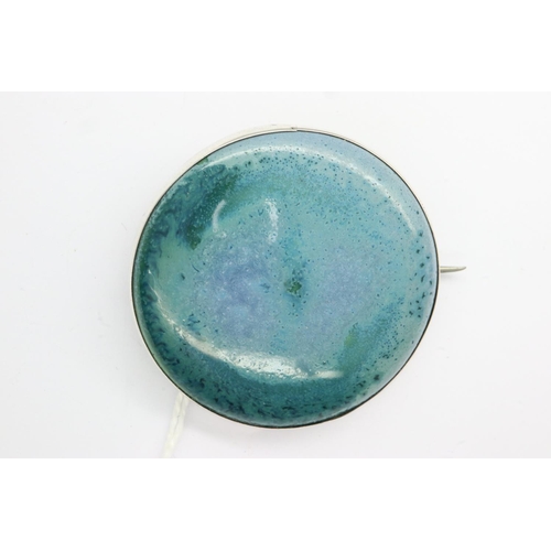 54 - Turquoise ceramic and silver brooch by Ruskin, stamped to rear, D: 40 mm. P&P Group 1 (£14+VAT for t... 