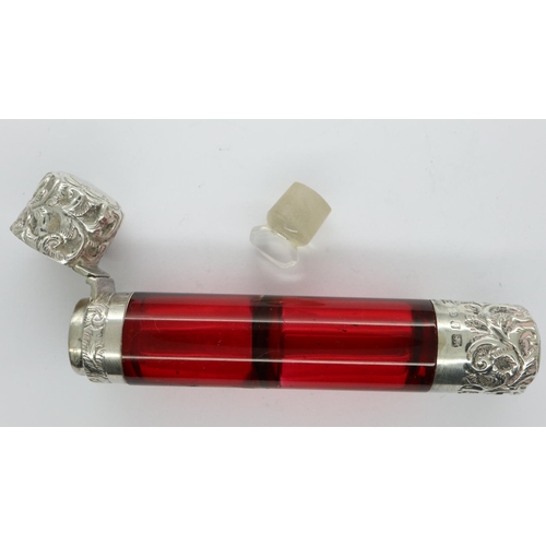 138 - Ruby glass and hallmarked silver double ended scent/smelling salt bottle, both stopper and cork inta... 