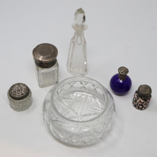 148 - Collection of five scent bottles, four with silver tops and a cut glass powder bowl. P&P Group 2 (£1... 