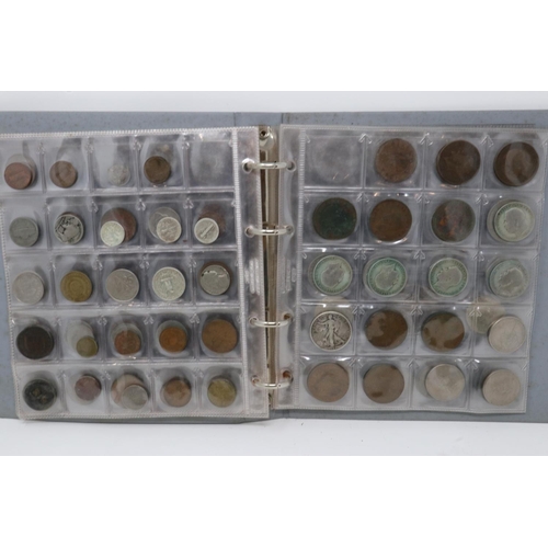 177 - A folder of mixed world coins, including some silver denominations. P&P Group 1 (£14+VAT for the fir... 