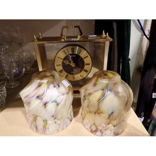 1028 - Seiko Quartz brass and glass mantle clock and Two floral polychrome glass lamp shades, H: 19 cm. Not... 