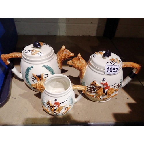1052 - Two Portland pottery teapots and a cream jug. Not available for in-house P&P