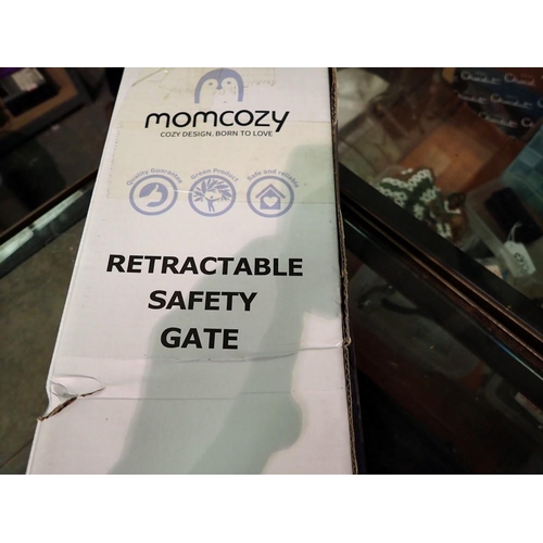1138 - Momcozy retractable safety gate. Not available for in-house P&P