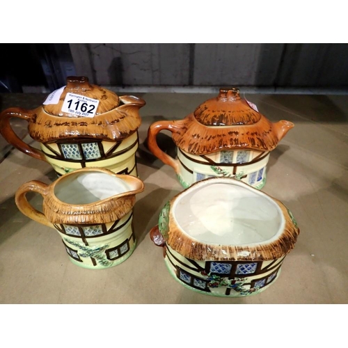 1162 - Four pieces of cottage ware. Not available for in-house P&P