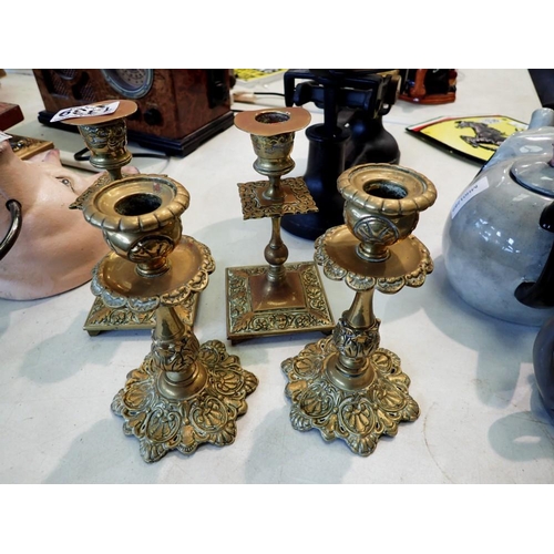 1339 - Four brass candle sticks. Not available for in-house P&P