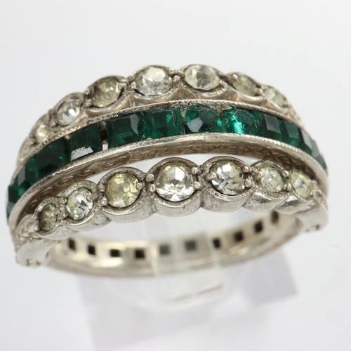 13 - Antique white metal day/night ring set with garnet, emerald and cubic zirconia, missing two emeralds... 