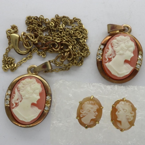 36 - Pair of 9ct gold shell cameo stud earrings with two matching yellow metal pendants, one on a yellow ... 