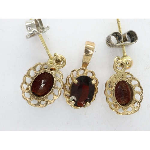 67 - Pair of 9ct gold drop earrings and pendant set with garnet. drop H: 17 mm, 2.3g. UK P&P Group 1 (£16... 