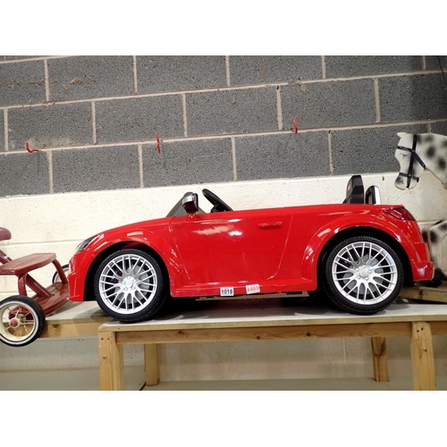 1018 - Childs red ride on Audi TT, working at lotting. Not available for in-house P&P