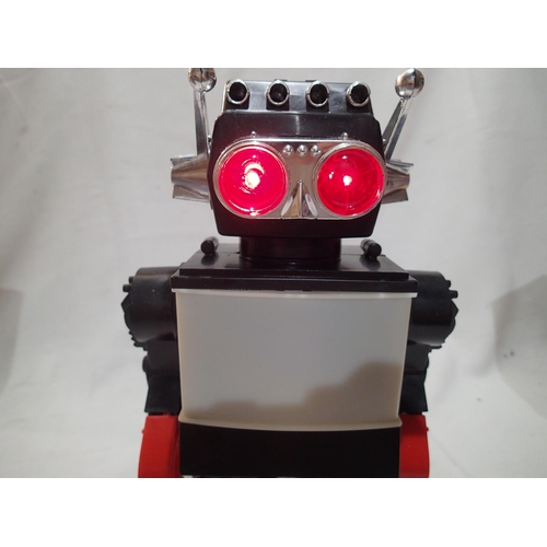 2439 - Rob-1 battery operated robot, H: 30 cm, with flashing eyes, light up screen, walking and moving arms... 