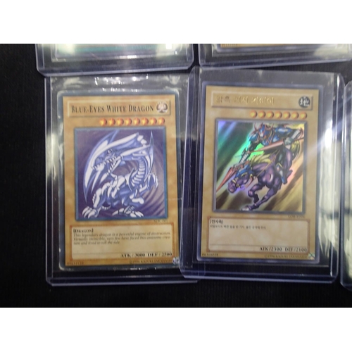 2202A - Small collection of sought after Yu-Gi-Oh! trading cards, to include three Blue-Eyes White Dragon. U... 