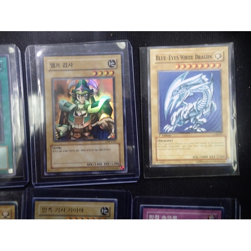 2202A - Small collection of sought after Yu-Gi-Oh! trading cards, to include three Blue-Eyes White Dragon. U... 