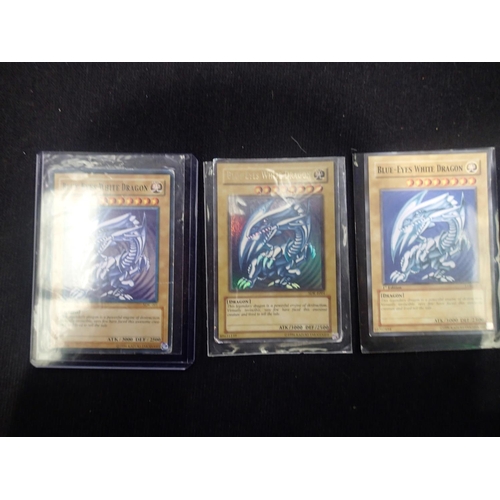 2202A - Small collection of sought after Yu-Gi-Oh! trading cards, to include three Blue-Eyes White Dragon. U... 