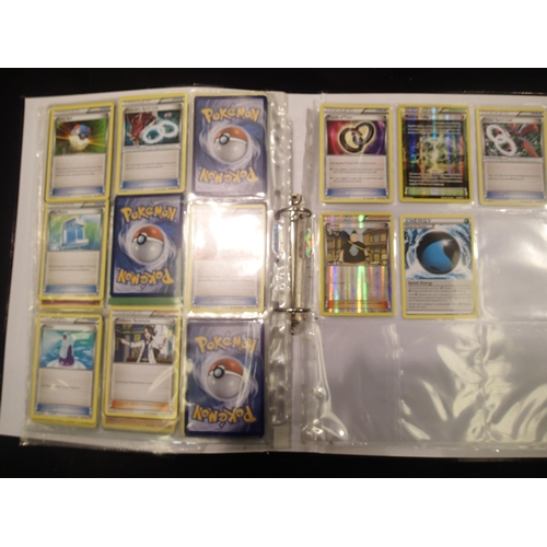 2202E - Collection of Pokemon trading cards in folder to include sought after trainer cards. UK P&P Group 1 ... 