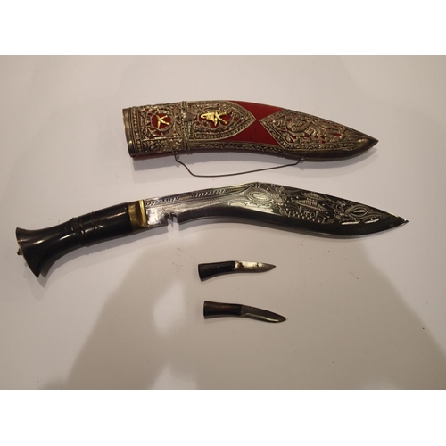 232 - *** WITHDRAWN *** An early 20th century Eastern presentation kukri, with brass mounted horn grip, a ... 